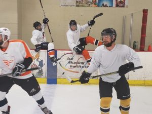 individuals playing hockey