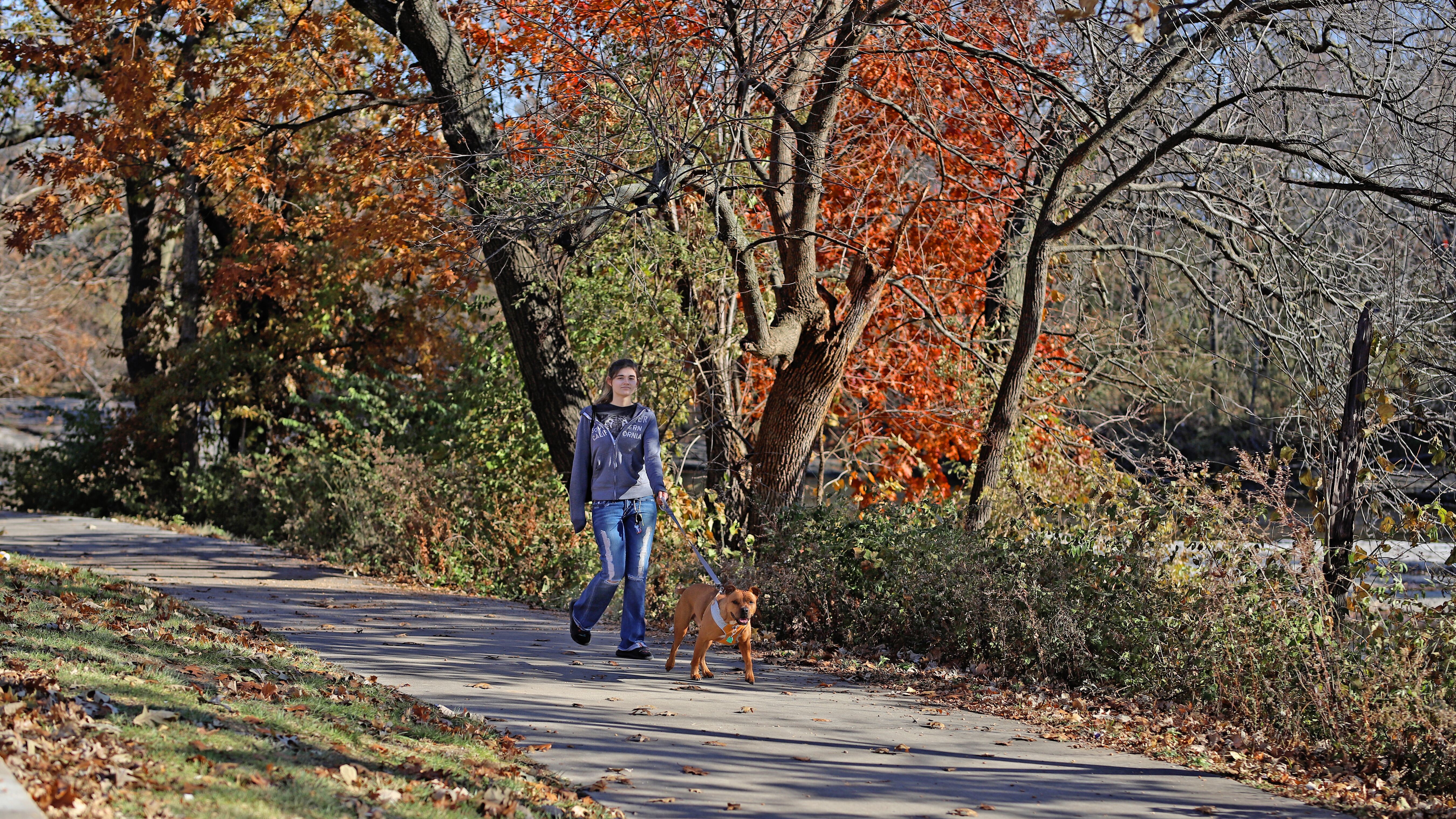 Girl walking her dog at Indian Creek