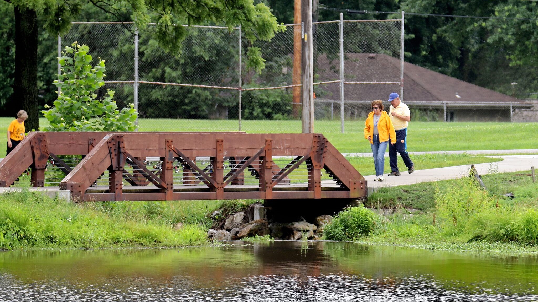 People walking on the bridge in Lakewood Green