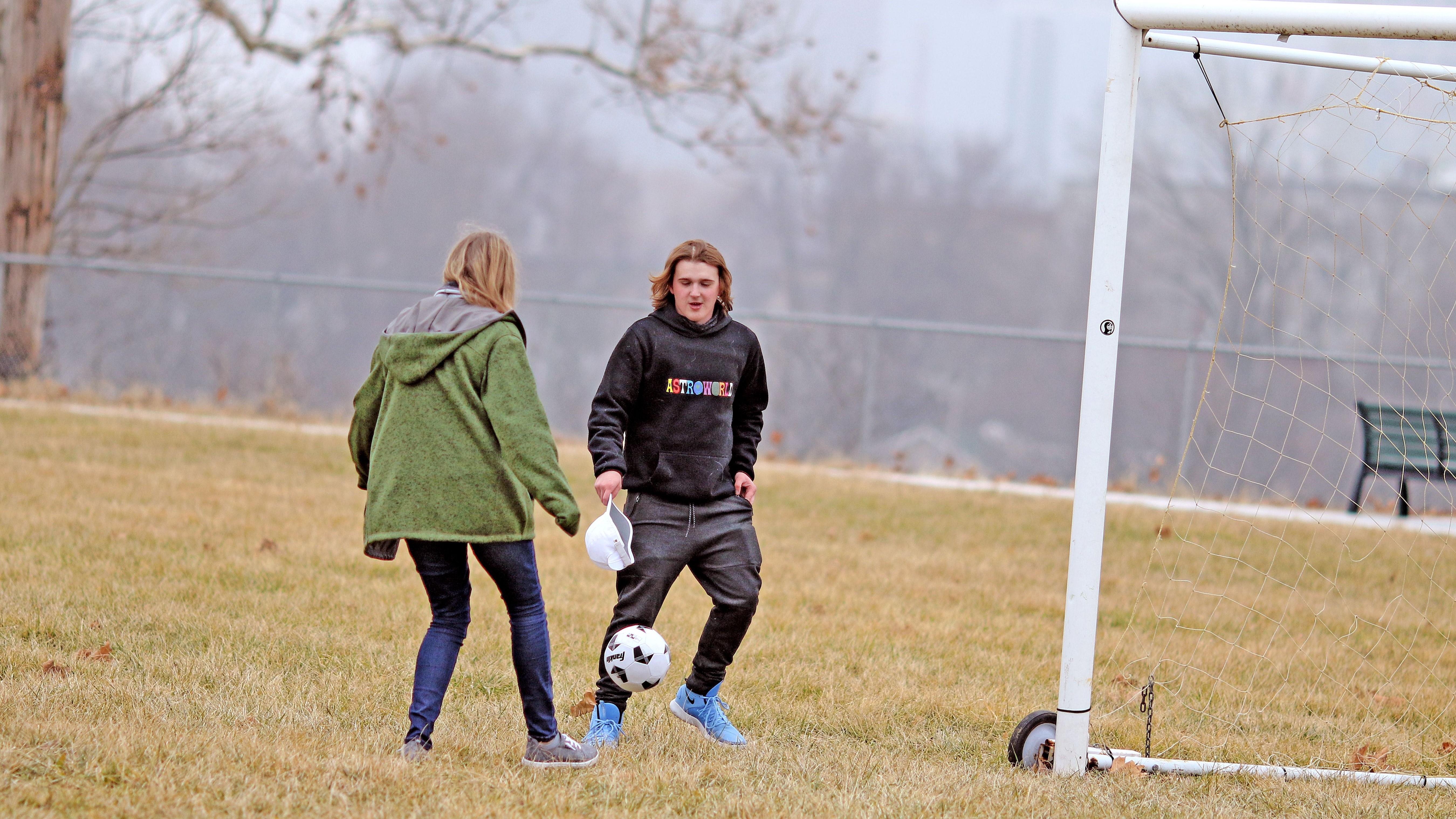 Teens playing Soccer