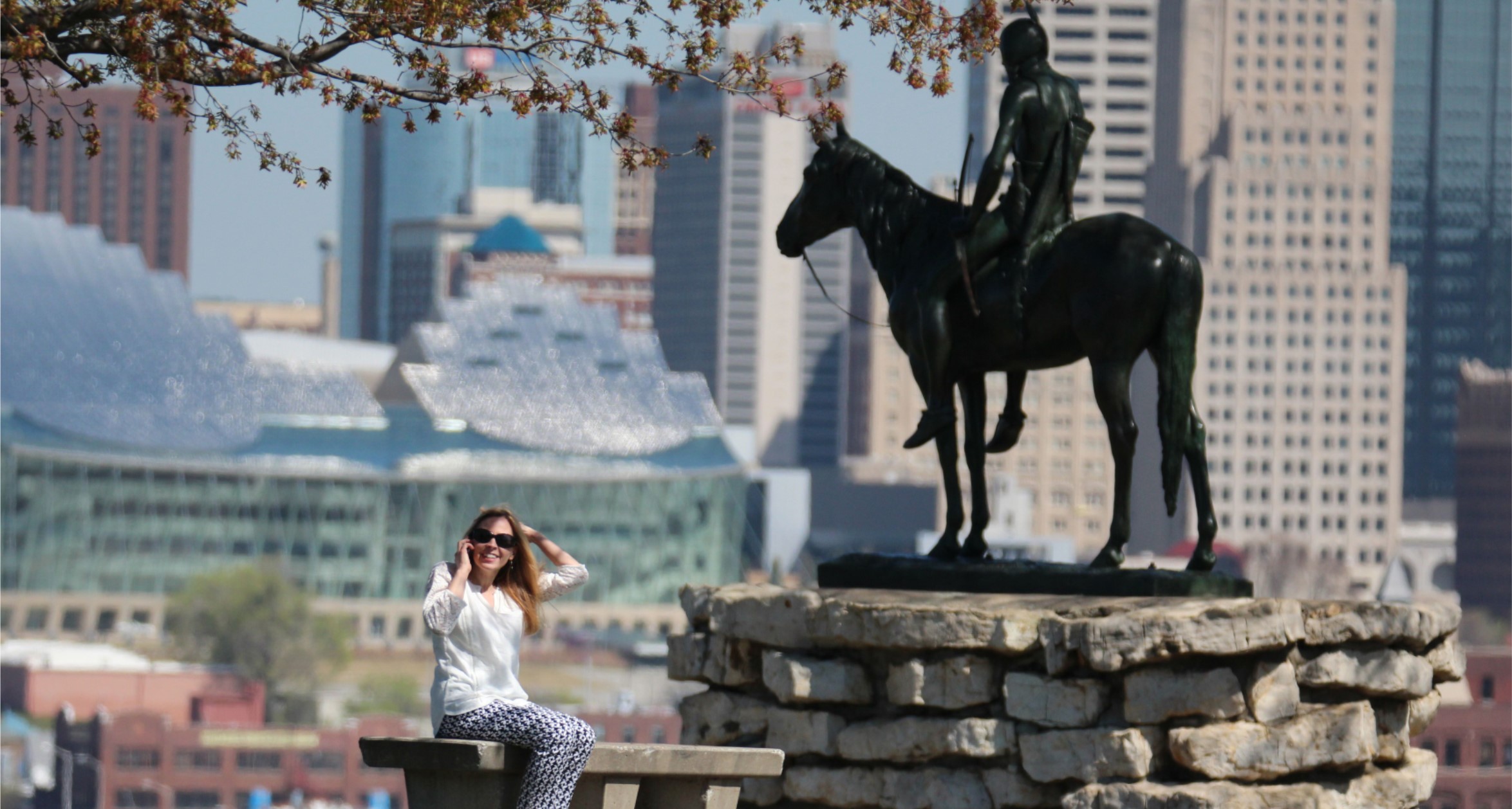 Girl posing infront of sculpture in Kansas City