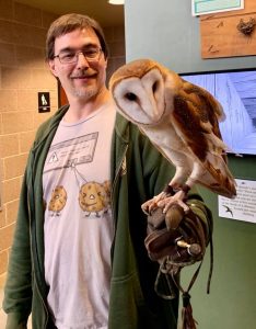 man holding owl