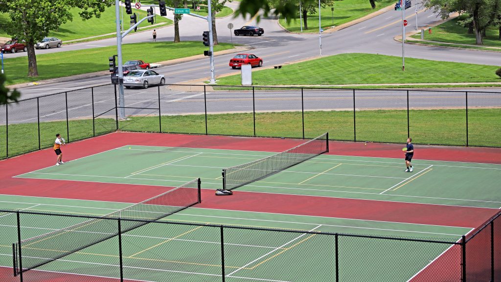 Kids playing tennis in the tennis court
