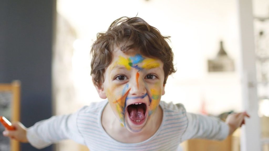 Kids with paint on his face
